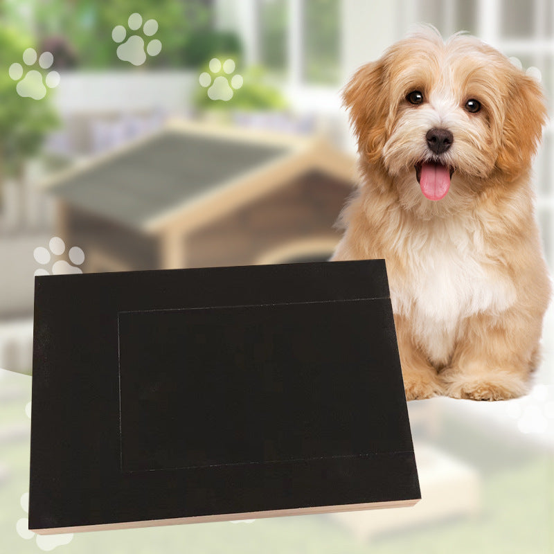 Black wooden dog nail board shown flat on the ground