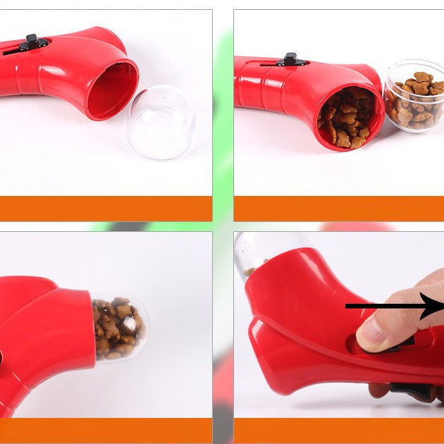 Red interactive pet throwing toy shown in use with treat loading