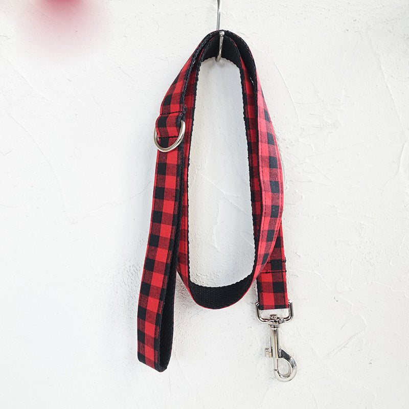 Red and black grid dog leash shown hanging to display full length