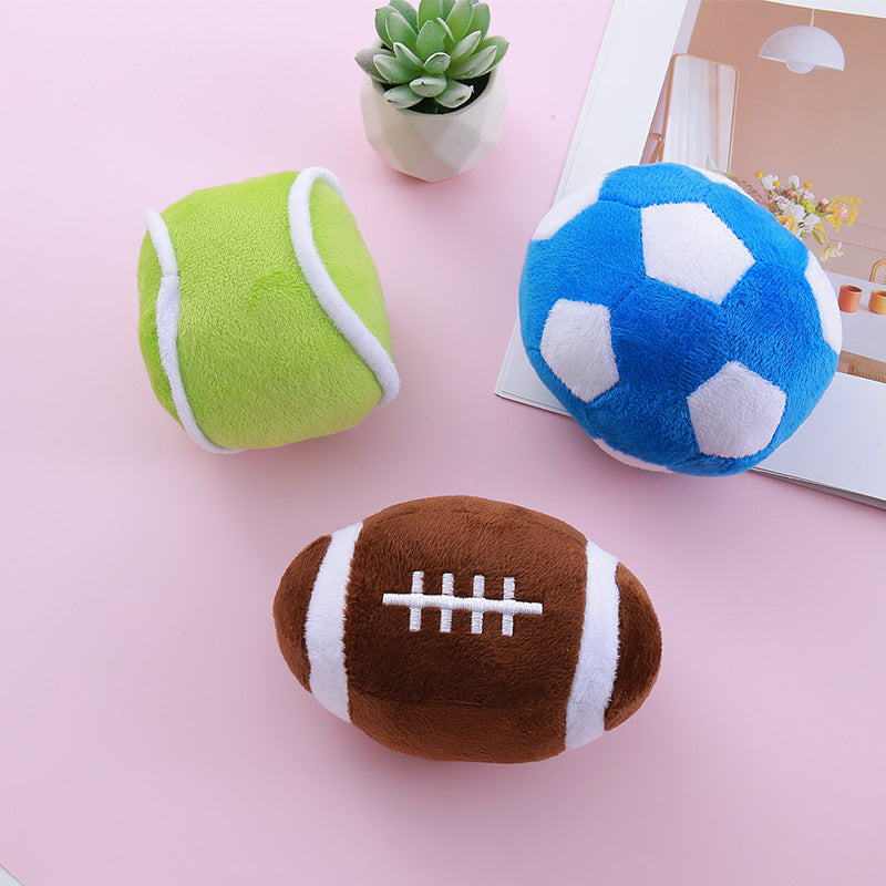 Group of soccer, olive, and football simulation dog toys on display