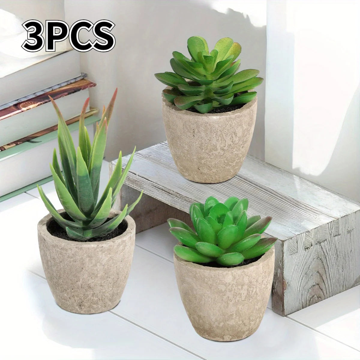 Three-piece artificial succulent planter indoor set on white shelf in gray ceramic pots