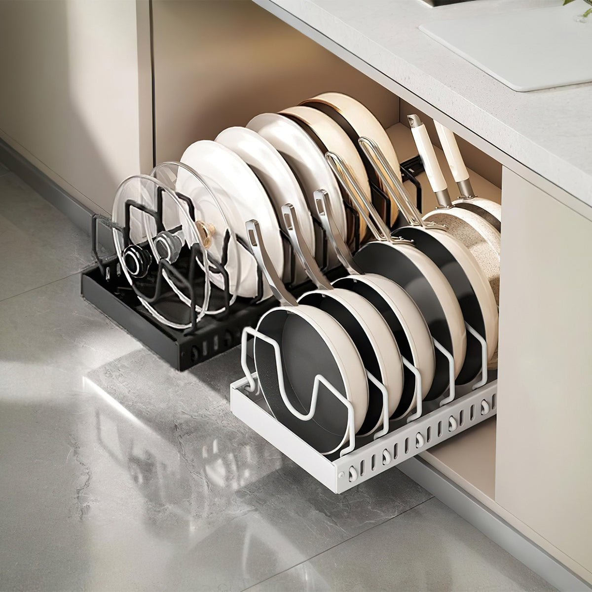 Pull-out organizer holding pans and lids upright inside a kitchen cabinet