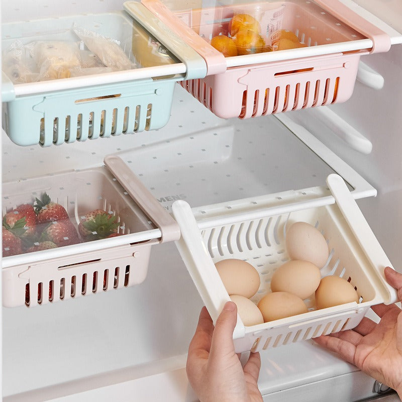 Four pull-out storage bins hanging under a fridge shelf with eggs, fruit and food