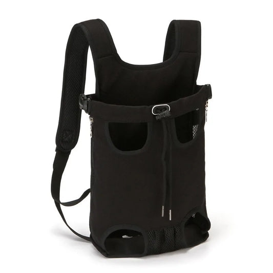 A black pet carrier backpack with padded shoulder straps, ventilation holes, and adjustable buckle straps