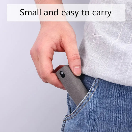 A hand placing a small gray device into a jeans pocket with text above.