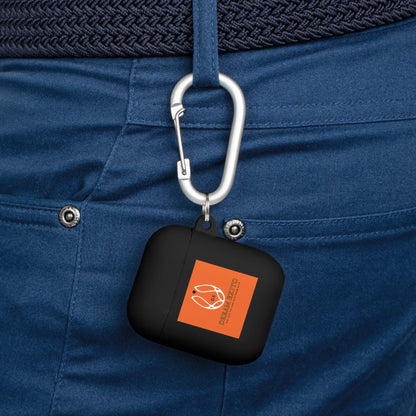 Black AirPods case with an orange logo attached to a blue belt loop using a carabiner.
