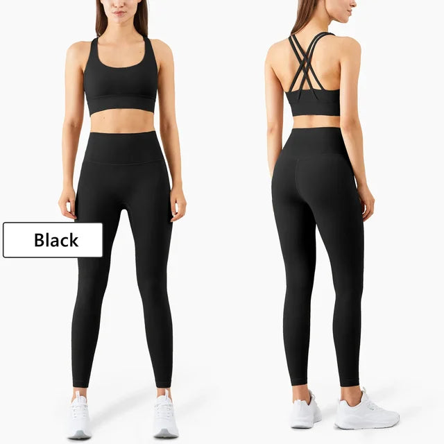 Black athletic set showing front and back views with strappy sports bra and high-waist leggings