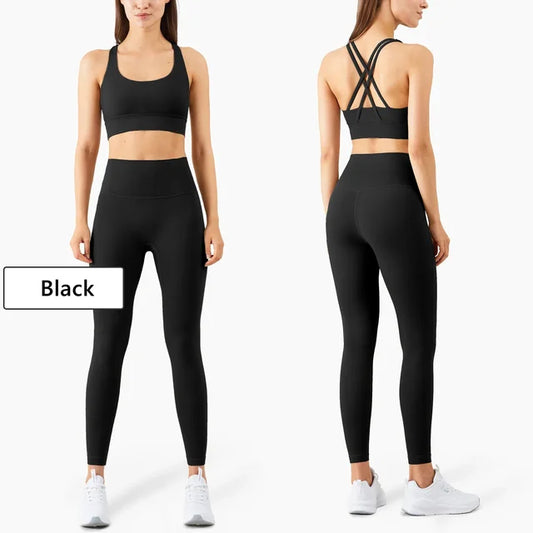 Black athletic set showing front and back views with strappy sports bra and high-waist leggings