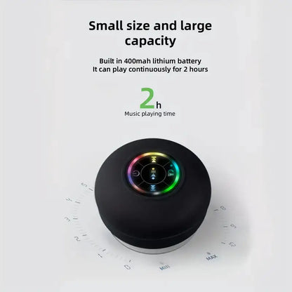 Black circular audio device with 400mAh battery capacity and 2-hour playback time