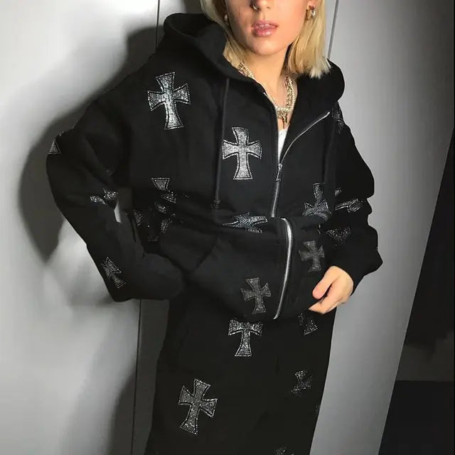 Black hoodie dress with metallic cross patterns worn by person with blonde hair and layered necklaces