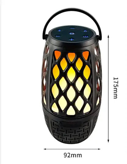 Black lantern-style speaker with flame-like light and control icons on top.