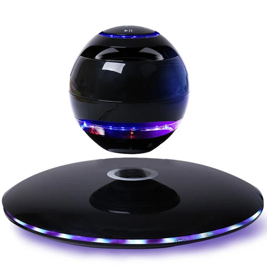 Black levitating speaker glowing with blue and purple lights against white background.