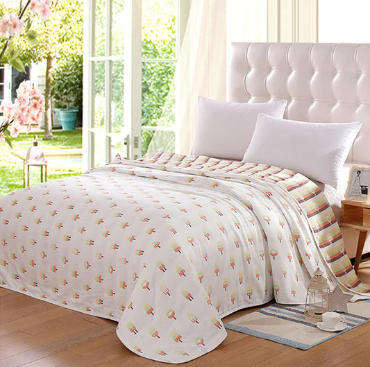 Bright bedroom with white tufted headboard and floral-patterned beds spread by sunny windows.
