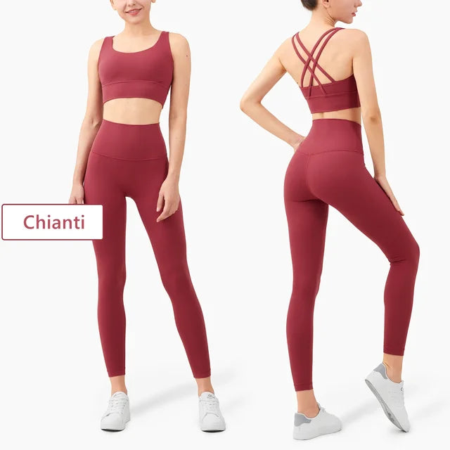 Chianti colored workout set with cross-back sports bra and high-waisted leggings in burgundy