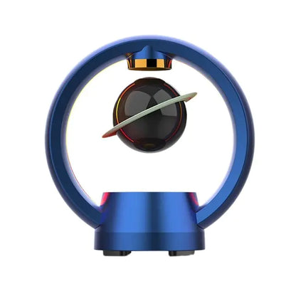 Clean product shot of blue circular magnetic levitation speaker with floating black sphere and ring against white background
