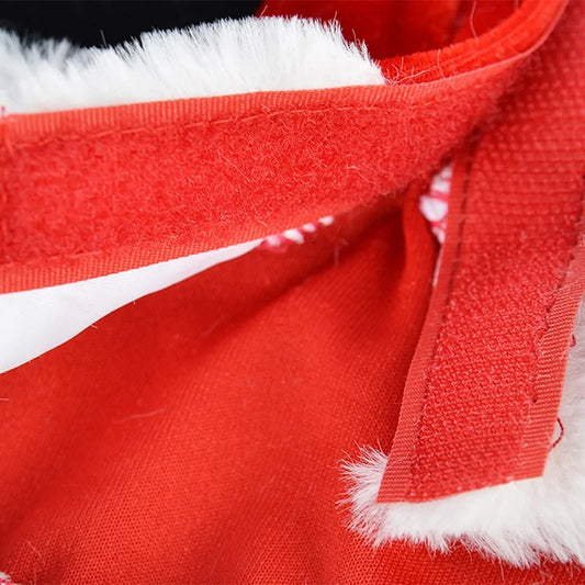 Close-up detail of red fabric with white fur trim, showing the textural contrast and stitching pattern
