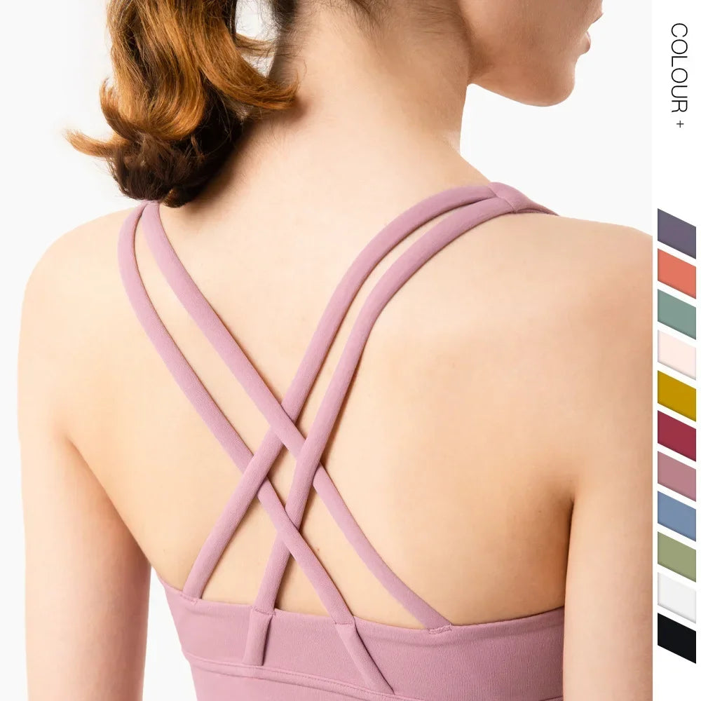 Close-up of pink strappy back detail with color swatches showing available athletic wear options