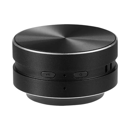 Compact black Bluetooth speaker with control buttons.