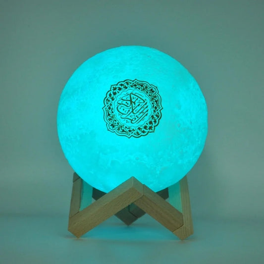 Glowing moon lamp on a wooden base with black calligraphy design.