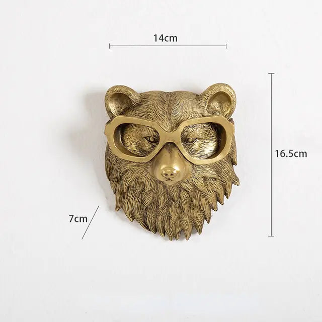 Gold bear head sculpture with glasses, dimensions marked 14 cm wide, 16.5 cm tall, and 7 cm deep