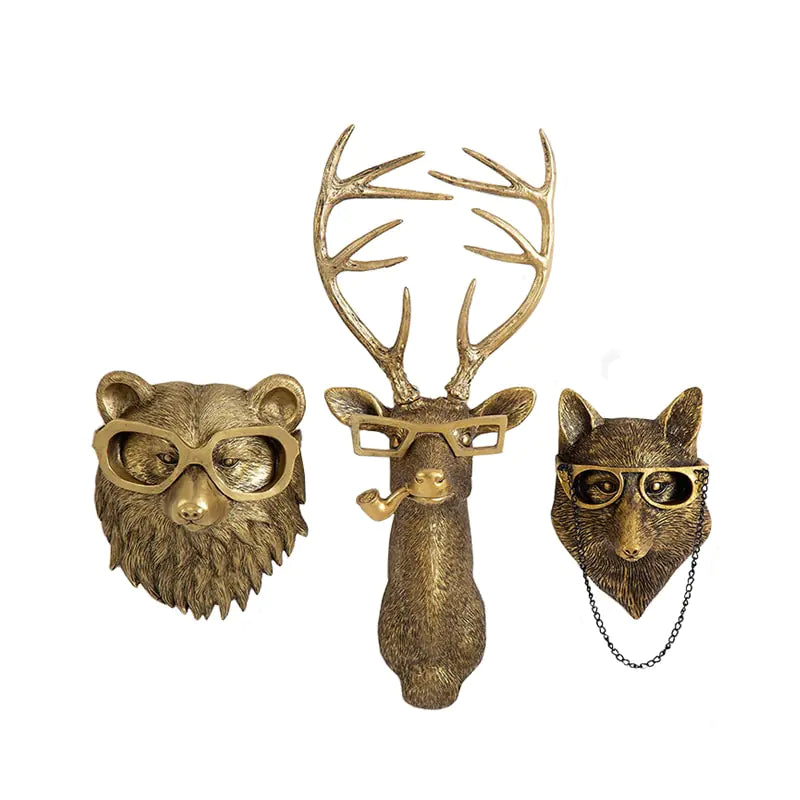 Golden animal wall mounts featuring a bear, deer, and fox, each wearing glasses