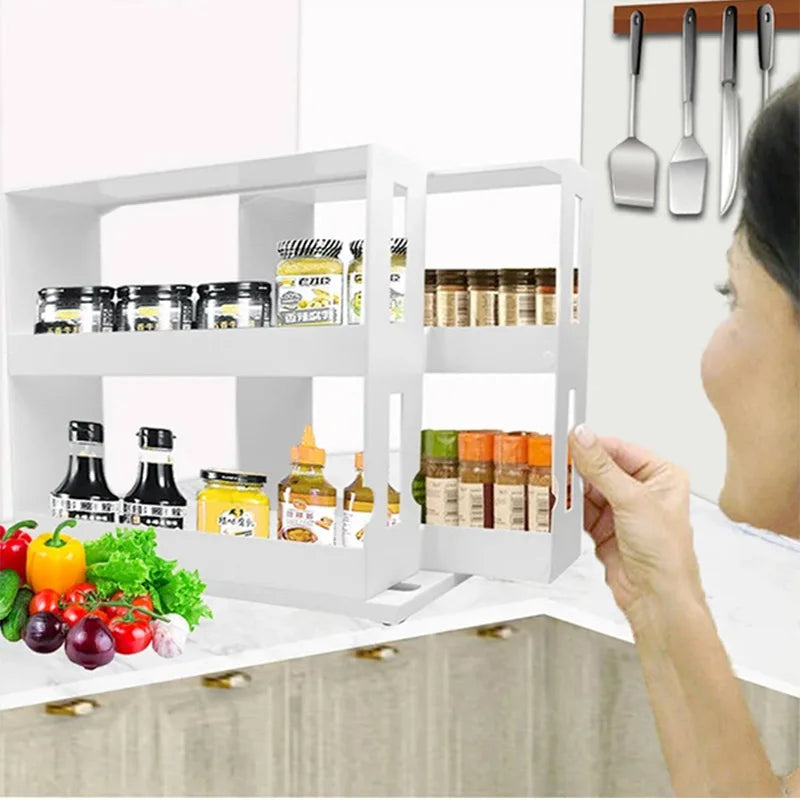 Rotating spice organizer rack in use in a kitchen cabinet with spice jars and bottles on each shelf