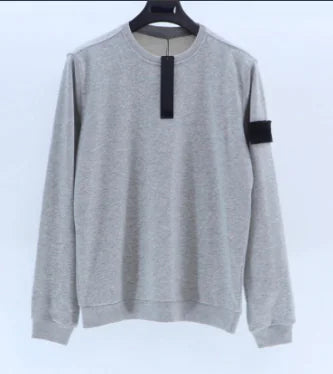Heather gray crewneck sweatshirt with black arm patch and front tag detail on white background