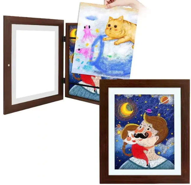 Hinged brown frame displaying children's artwork: cat drawing and whimsical portrait with space theme background