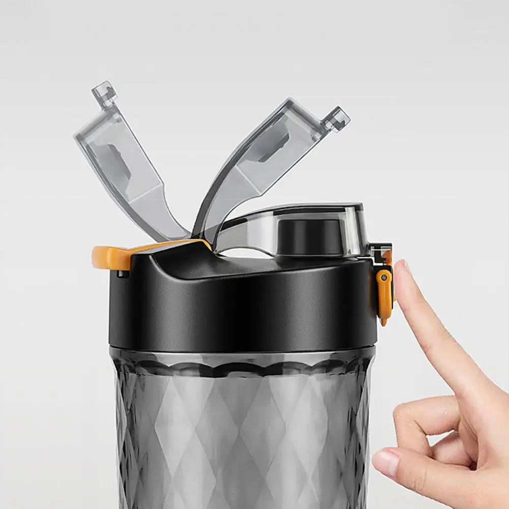 Close-up of LED Portable Wireless Shaker Bottle lid being opened to reveal the spout
