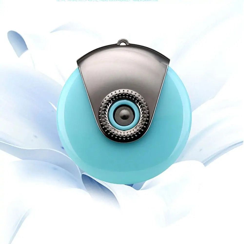Light blue facial humidifier with silver cap on white flower petals background.