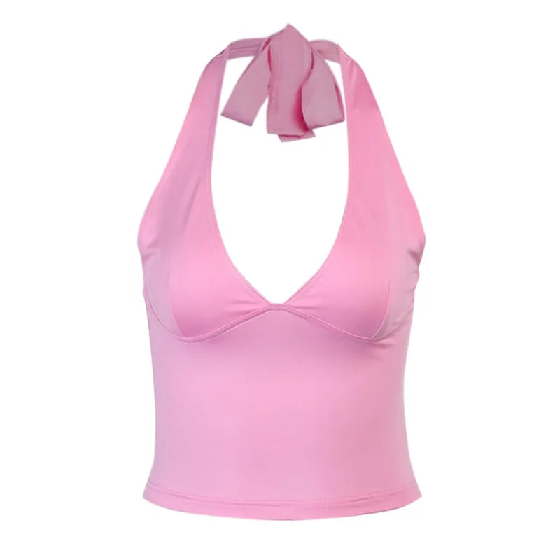 Light pink halter swimsuit top with tie-neck design shown on white background, product photography style