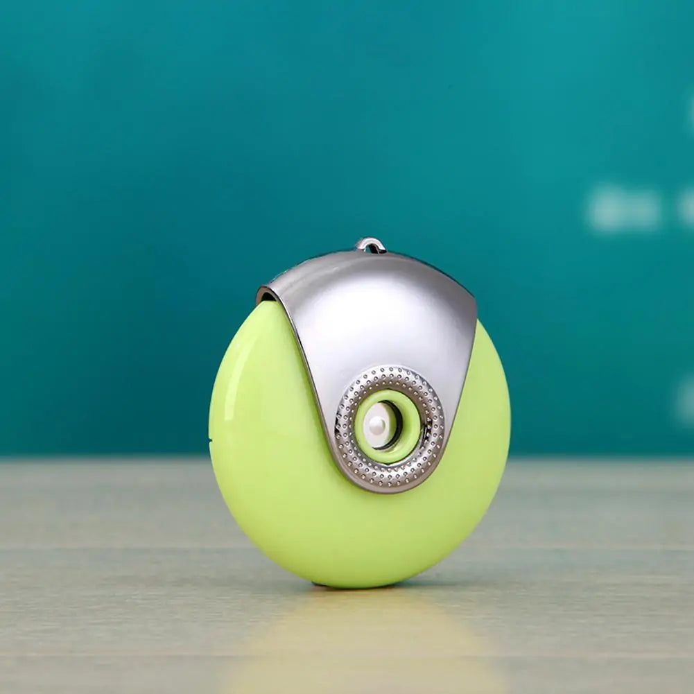 Lime green egg-shaped facial humidifier with silver cap on teal background.
