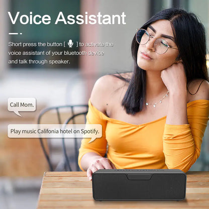 Marketing image showing a person in a yellow top using the speaker's voice assistant feature, with speech bubbles demonstrating voice commands.