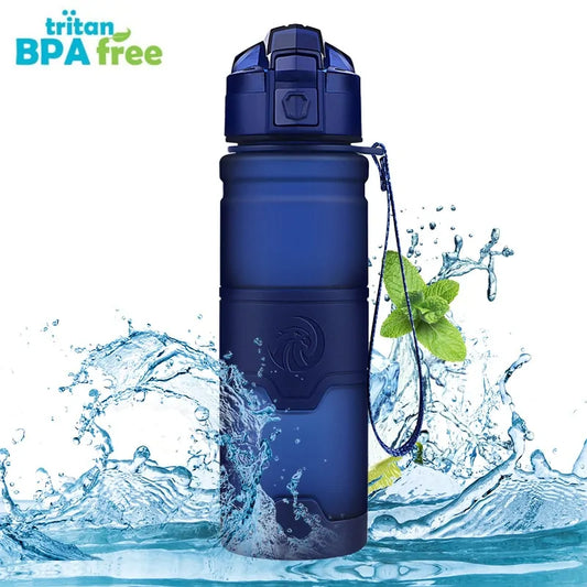 Navy blue BPA-free sports water bottle with flip-top lid and wrist strap in water splash.