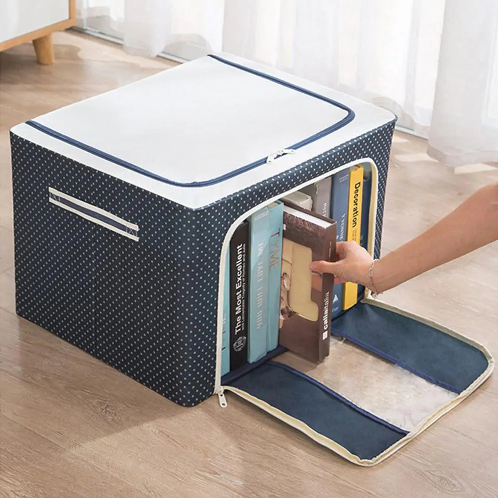 Navy polka-dot storage box with side opening design showing stored books being accessed by hand