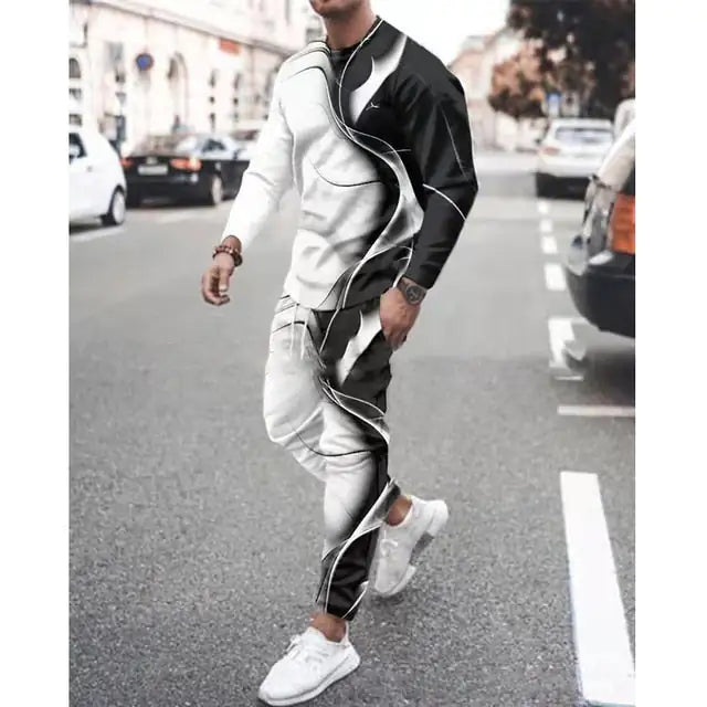 Person wearing split black and white tracksuit with curved dividing line design, matched with white sneakers