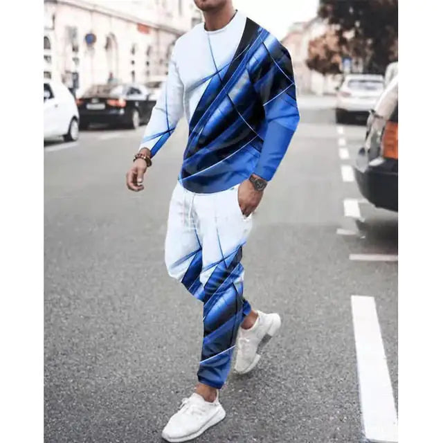 Person wearing white and royal blue tracksuit with diagonal stripe pattern, matched with white sneakers on street