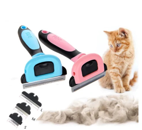 Pink and blue pet deshedding tools with size attachments next to ginger cat and pile of removed pet fur on white