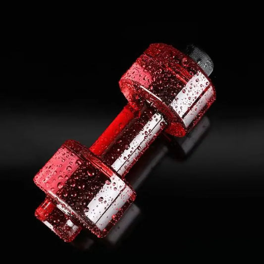 Red metallic dumbbell-shaped water bottle with water droplets on surface against black background.