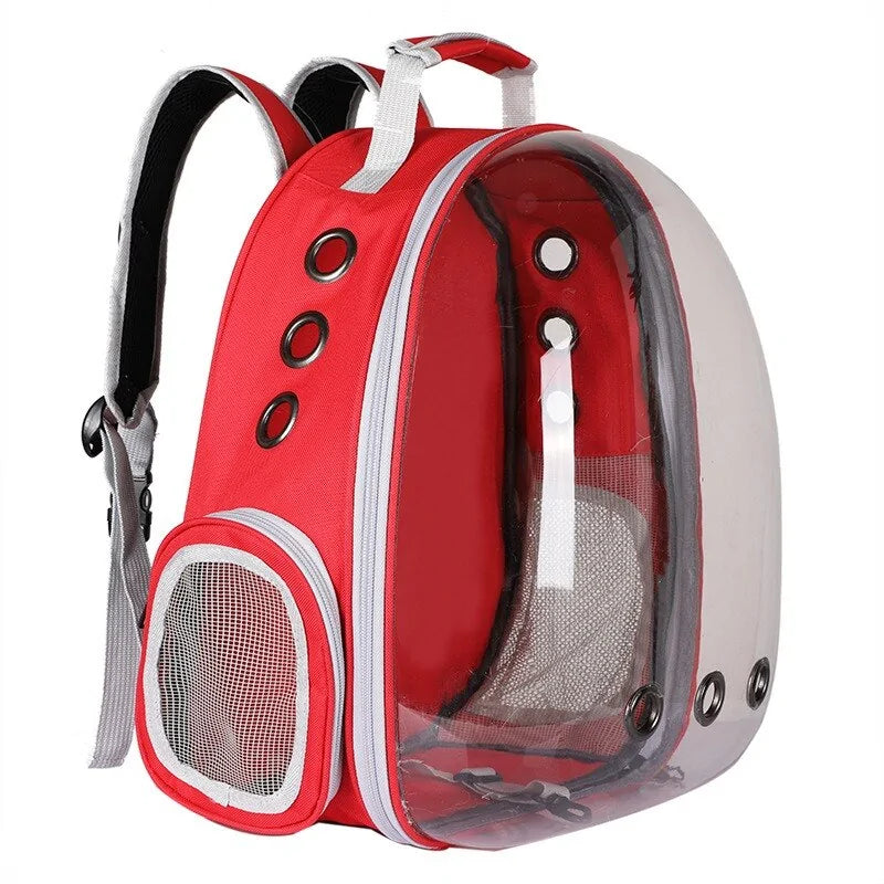 Red pet carrier backpack with clear bubble window, ventilation holes, and mesh pocket for pet visibility