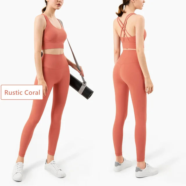 Rustic Coral workout set with cross-back sports bra, high-waist leggings and yoga mat carrier