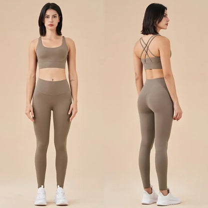 Taupe athletic set featuring crop top with criss-cross back straps and high-waisted leggings