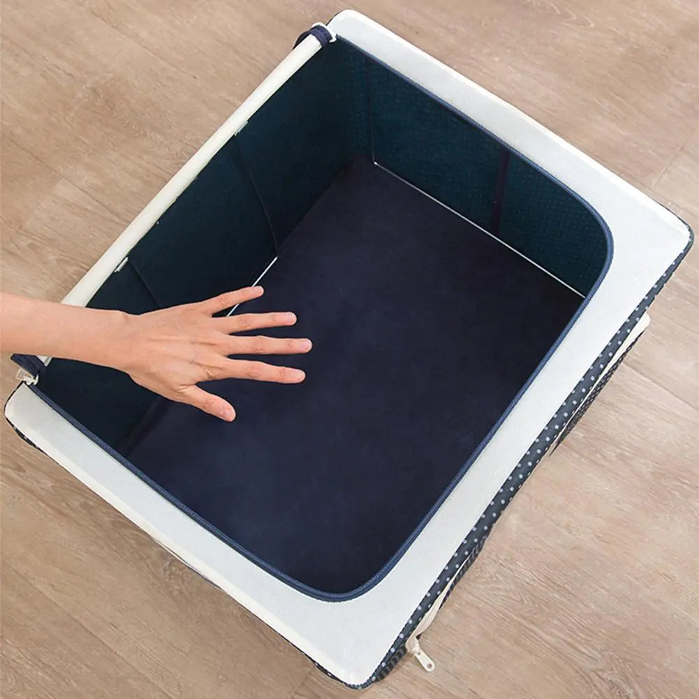 Top view of empty navy storage box with white trim, showing spacious interior on wooden floor