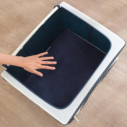 Top view of empty navy storage box with white trim, showing spacious interior on wooden floor
