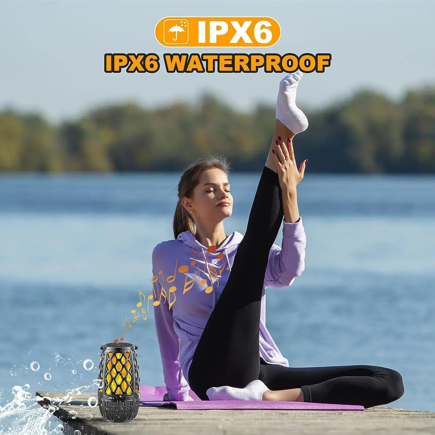 Woman doing yoga by a lake with a waterproof Bluetooth speaker nearby. 