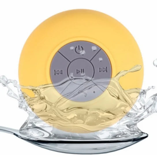 Yellow waterproof speaker with splash of water.