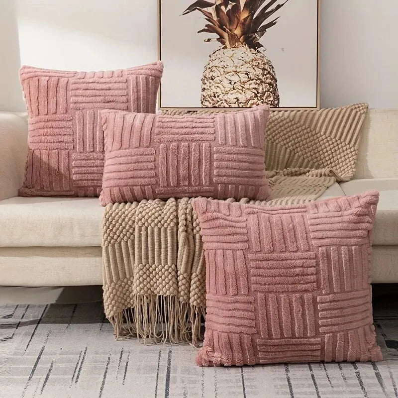 Pink boho faux fur throw pillow covers arranged on sofa