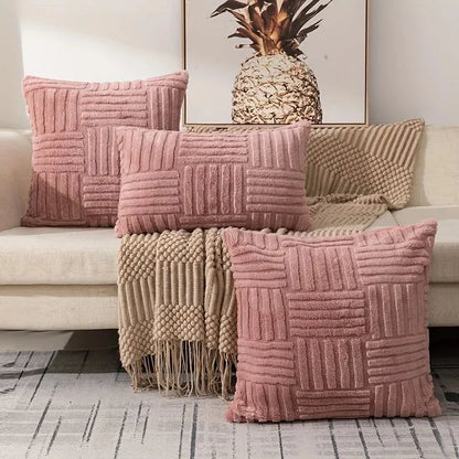 Pink boho faux fur throw pillow covers arranged on sofa