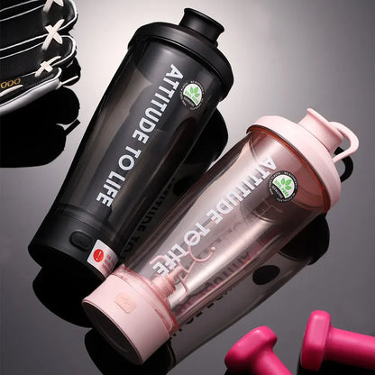 Black and pink electric protein shaker bottles shown for fitness and travel drink mixing.