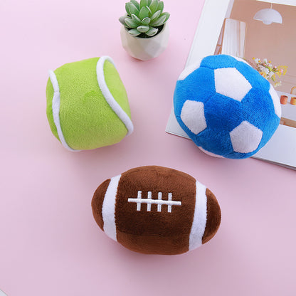 Group of soccer, olive, and football simulation dog toys on display